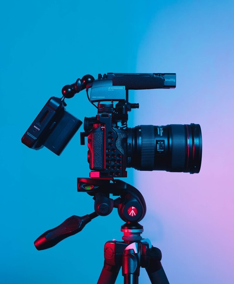 black dslr camera on green surface